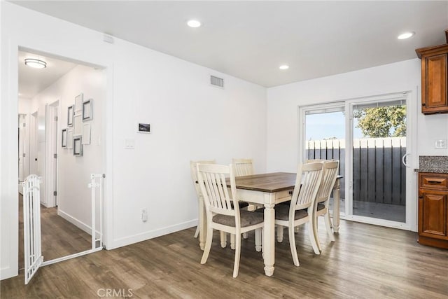 dining area featuring dark hardwood / wood-style floors