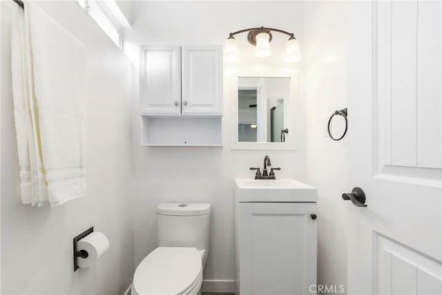 bathroom with toilet and vanity