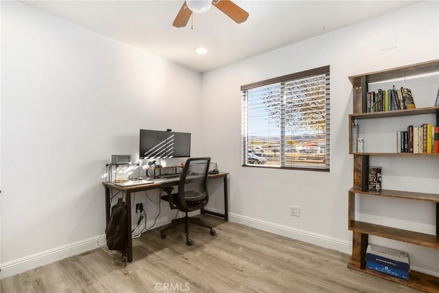 office featuring ceiling fan and light hardwood / wood-style flooring