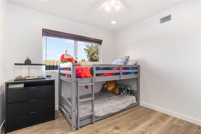 bedroom featuring ceiling fan and hardwood / wood-style floors