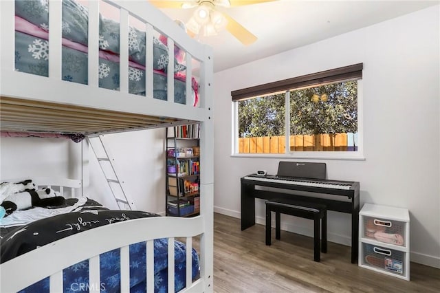 bedroom featuring ceiling fan and hardwood / wood-style floors