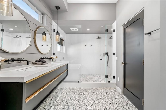 bathroom with an enclosed shower and vanity