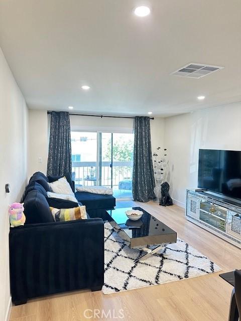 living room with light hardwood / wood-style flooring