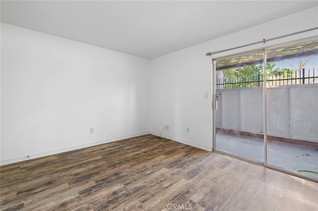 empty room with dark wood-type flooring