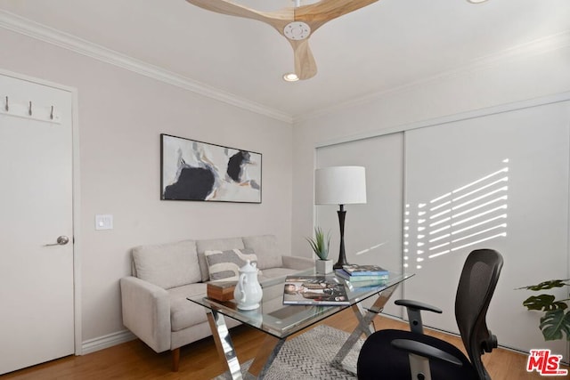 home office with ornamental molding and hardwood / wood-style flooring