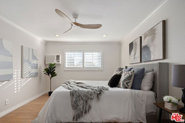 bedroom featuring ornamental molding, a wall mounted AC, ceiling fan, and wood-type flooring