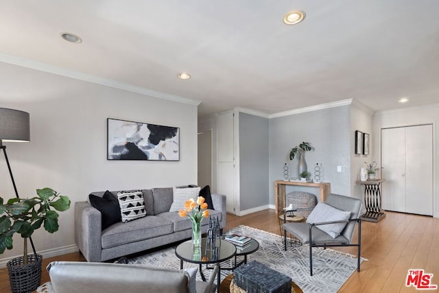 living room featuring ornamental molding and hardwood / wood-style flooring