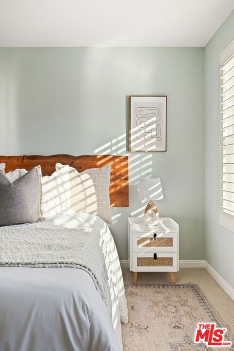 unfurnished bedroom with light colored carpet