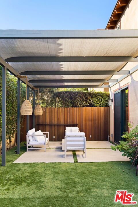 view of patio featuring a pergola and outdoor lounge area