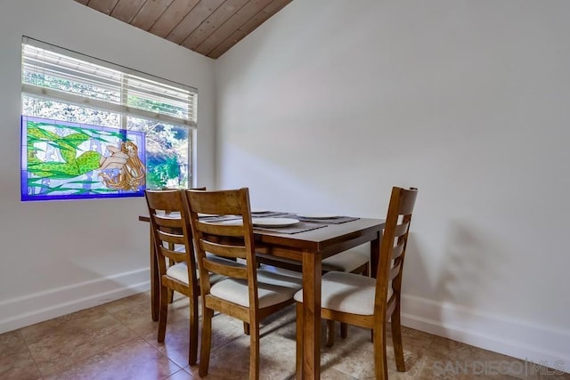 dining area featuring wooden ceiling and vaulted ceiling