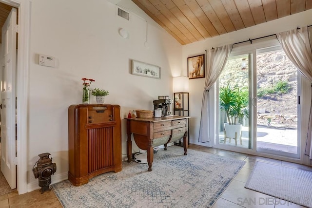 doorway featuring light tile patterned flooring, vaulted ceiling, and wood ceiling