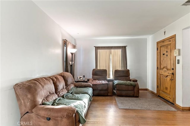 living room with light hardwood / wood-style floors