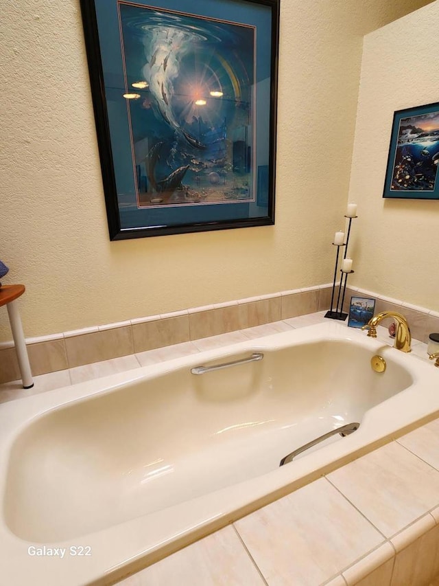 bathroom with tiled bath