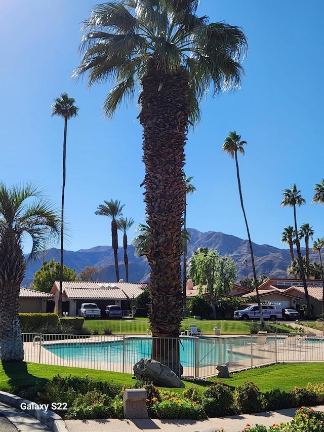 view of swimming pool featuring a mountain view