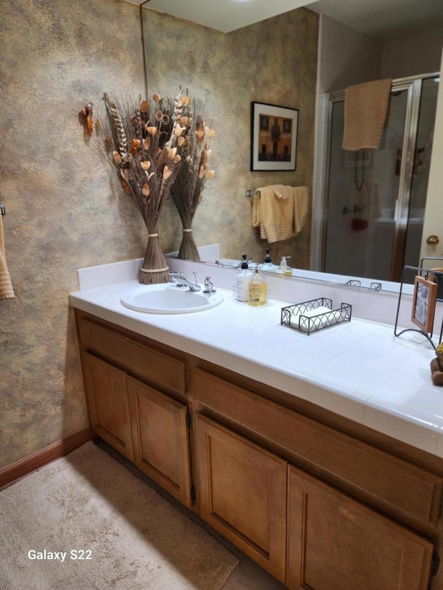 bathroom featuring vanity and walk in shower