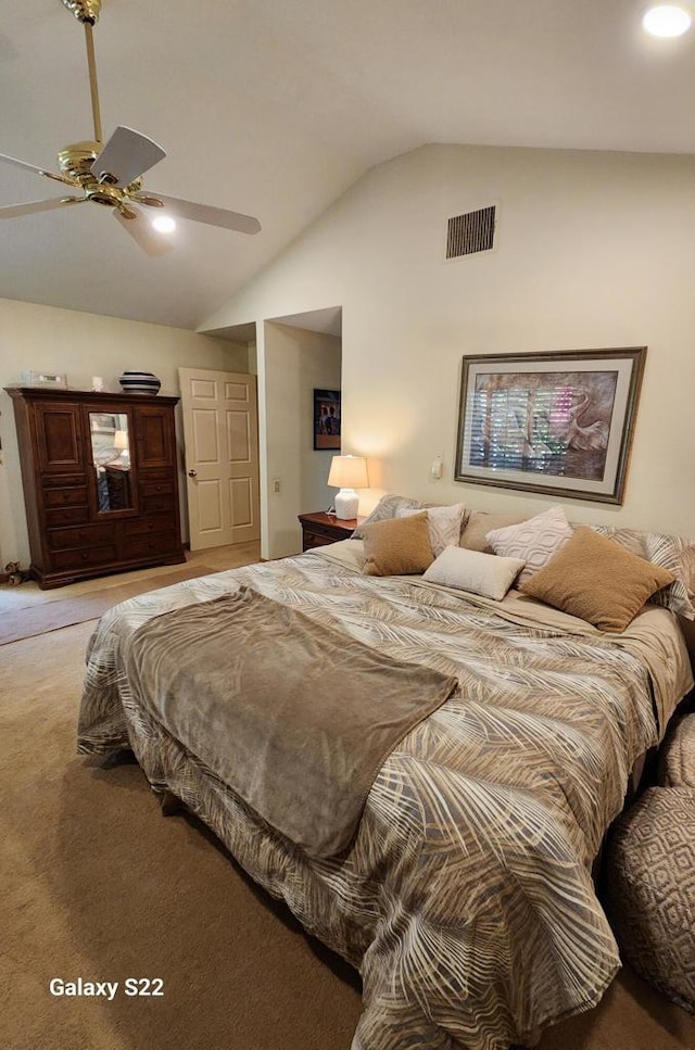 bedroom featuring vaulted ceiling, carpet flooring, and ceiling fan