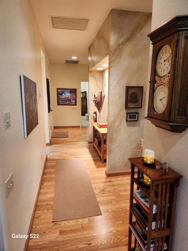 hallway featuring light hardwood / wood-style flooring