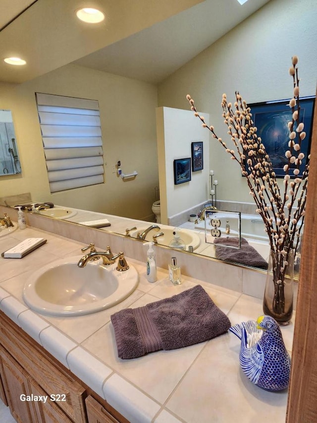 bathroom featuring tile patterned floors, toilet, and vanity