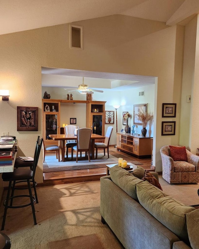 living room with vaulted ceiling and ceiling fan