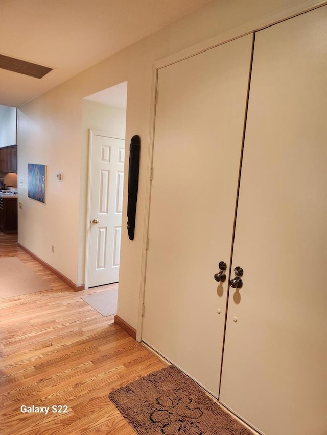 hallway featuring light hardwood / wood-style flooring