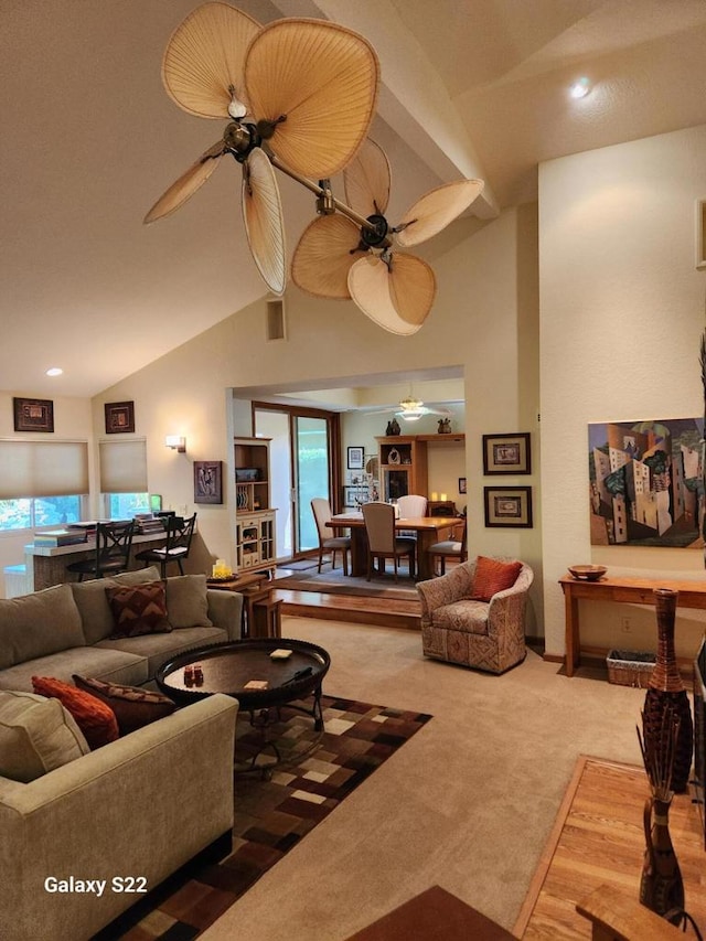 living room with carpet, high vaulted ceiling, and ceiling fan