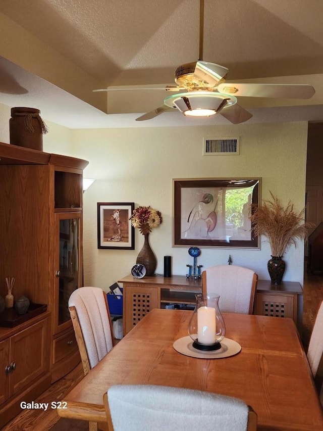 dining space with a textured ceiling