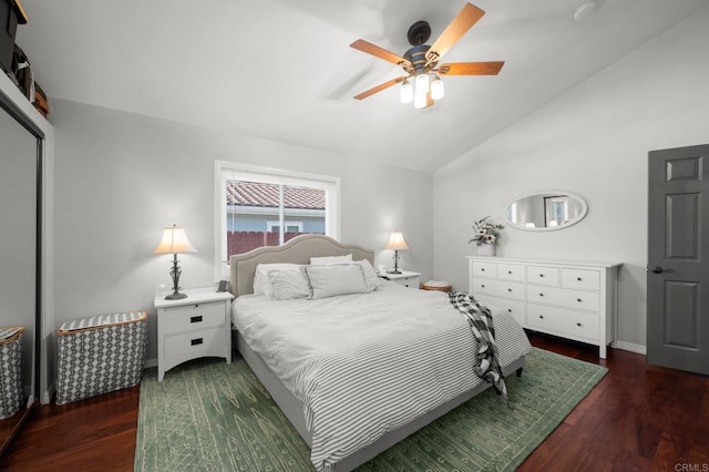 bedroom with lofted ceiling, ceiling fan, and dark hardwood / wood-style floors