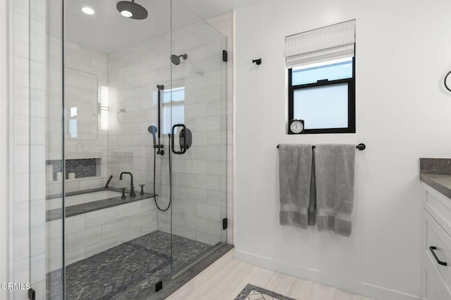 bathroom with vanity, tile patterned flooring, and a shower with door