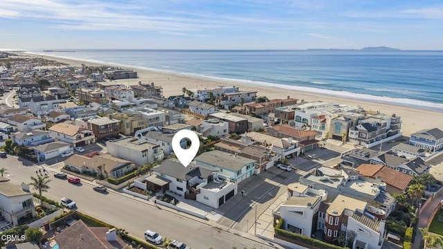 drone / aerial view with a view of the beach and a water view