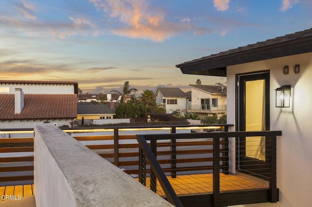 view of balcony at dusk