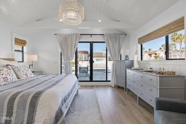 bedroom featuring lofted ceiling, light hardwood / wood-style flooring, wooden ceiling, a notable chandelier, and access to exterior