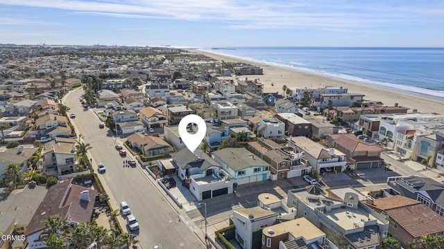 aerial view featuring a water view and a beach view