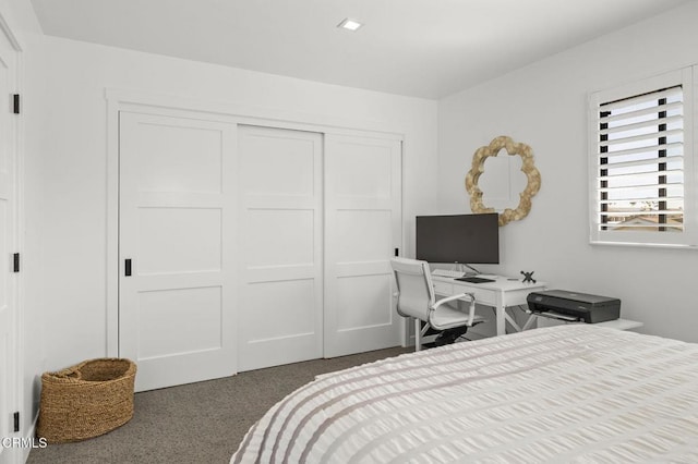 carpeted bedroom featuring a closet