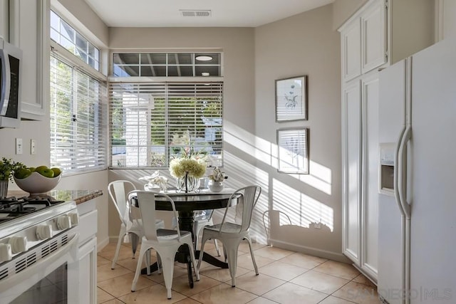 dining room featuring light tile patterned flooring