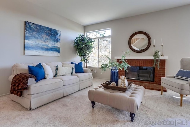 living room featuring carpet floors and a fireplace