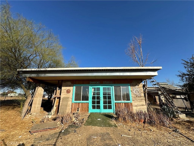 back of property with french doors