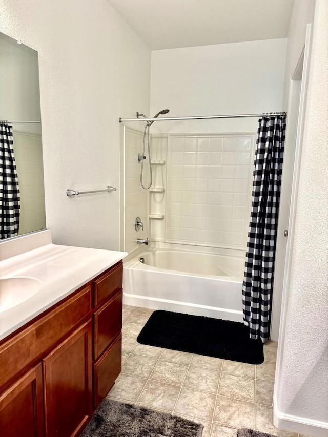 bathroom featuring vanity and shower / tub combo with curtain