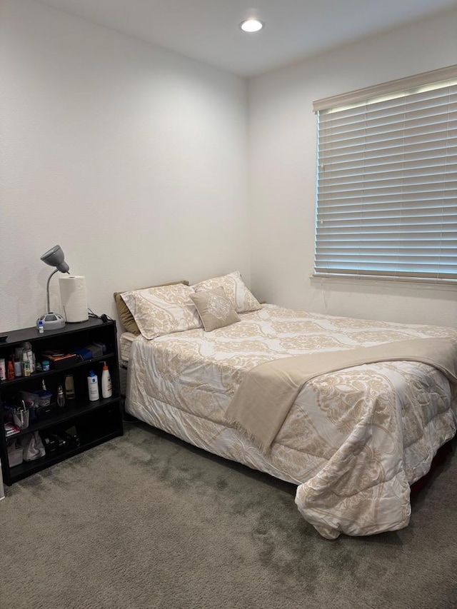 bedroom with dark carpet