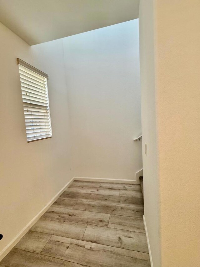 unfurnished room with light hardwood / wood-style floors