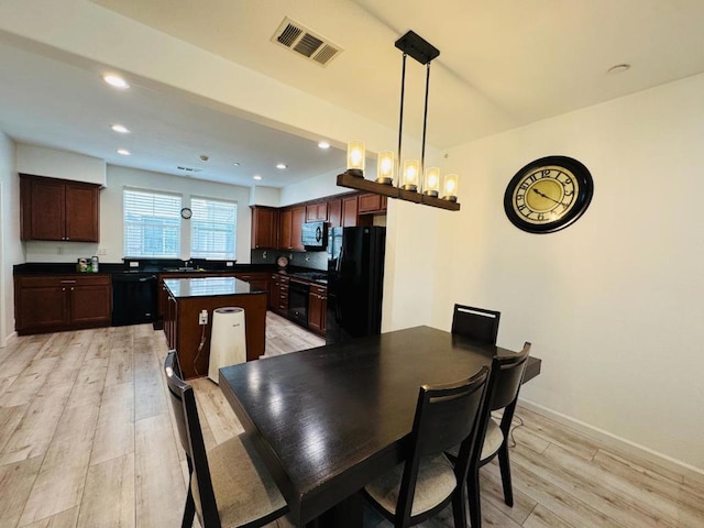 dining room featuring light hardwood / wood-style floors