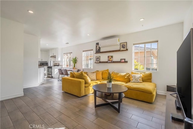 living room with a wall unit AC