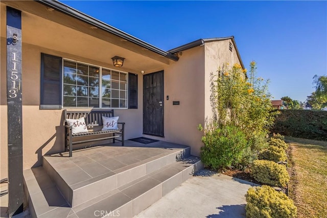 doorway to property with a patio