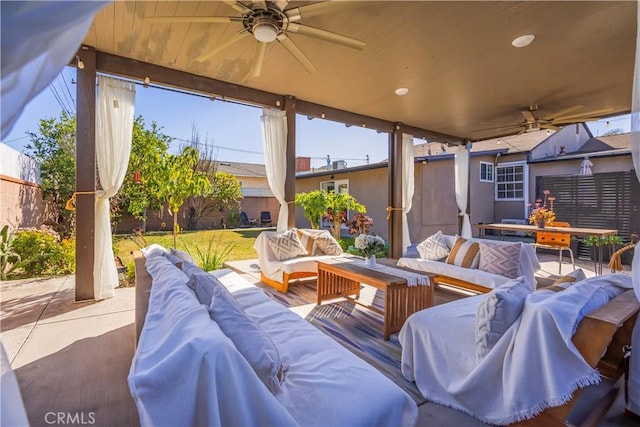 view of patio / terrace with ceiling fan and outdoor lounge area