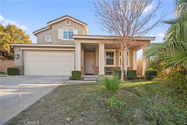 view of front of home with a front yard and a garage