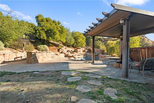 view of yard featuring ceiling fan and a patio area