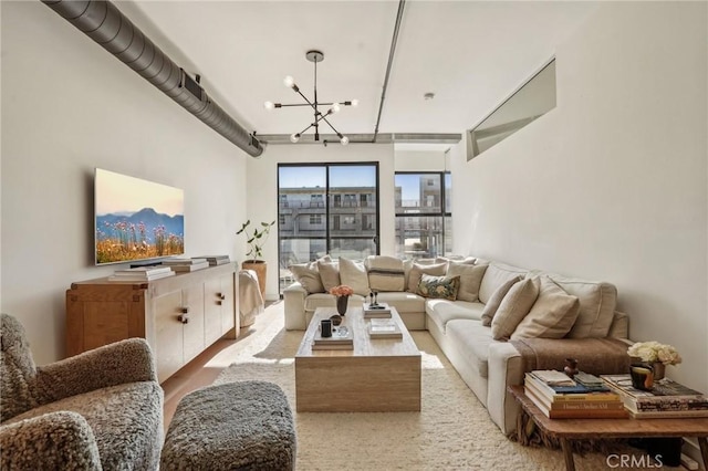 living room with an inviting chandelier