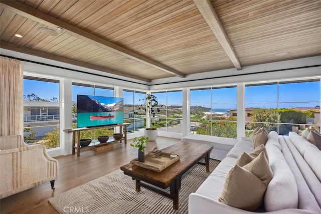 sunroom / solarium with wooden ceiling, beam ceiling, and a healthy amount of sunlight