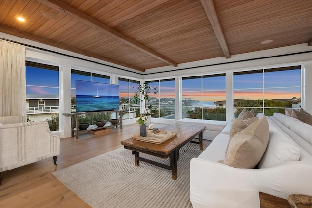 sunroom with beam ceiling and wooden ceiling