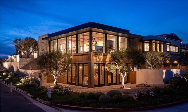 view of outdoor building at dusk