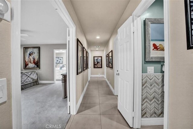 hallway with light tile patterned flooring